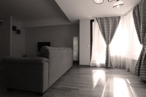 Living room with big bay window and curtains 