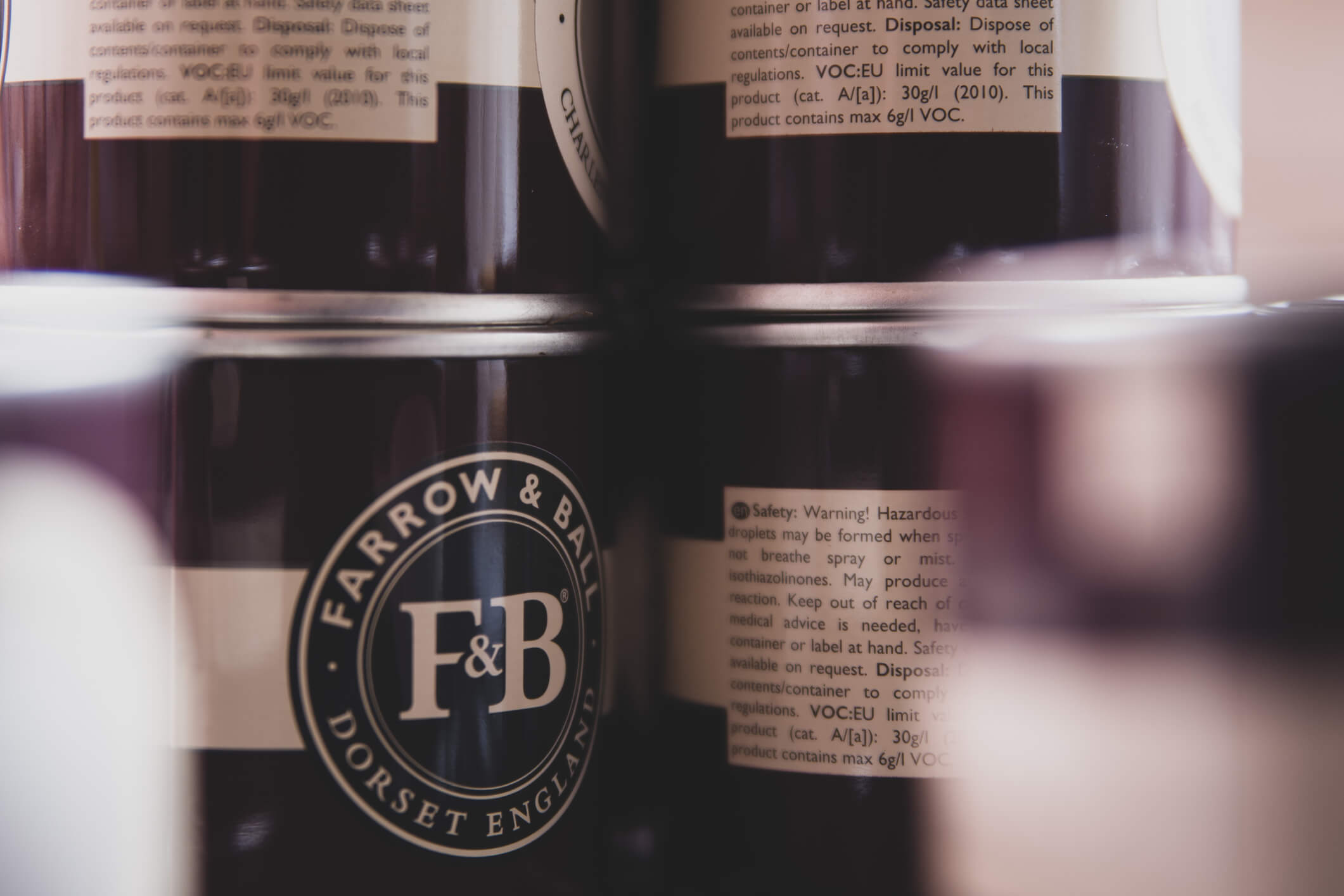 Sample pots of the premium Farrow and Ball paint arranged.